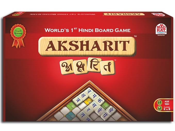 A board game box labeled "AKSHARIT" with the tagline "World's 1st Hindi Board Game" and a ribbon icon saying "Award Winning" in the upper left corner, featuring Hindi letters on tiles and a partial view of the game board on the bottom of the box. The age recommendation is 10+, for 2 to 8 players, with a logo of Mad Rat Games in the lower right corner.