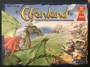 Box cover of the board game "Elfenland" showing a fantasy illustration with a person riding a green dragon on the left, a unicorn with a rider on the right, and a castle in a distant landscape, with the text "Alan R. Moon" at the top, "Elfenland" in large stylized script, and award badges for "Spiel des Jahres 1998" along with "Rio Grande Games" logo at the bottom right.