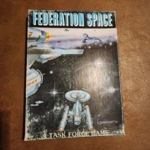 A worn-out board game cover titled "FEDERATION SPACE A TASK FORCE GAME," featuring stylized illustrations of spacecraft against a starry background.