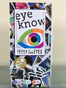 Box cover of the "eye know" board game with the subtitle "Trivia for your eyes" featuring a colorful eye graphic, multiple images including landmarks and animals, and badges indicating it is a Mensa Select winner, suitable for ages 12 and up, a family game for 2+ players, lasting about 20 minutes per round.