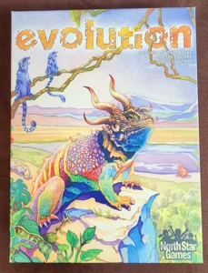 Board game cover titled "Evolution" with vibrant illustration of a fantastical lizard-like creature on a rocky landscape, surrounded by plant life and other smaller creatures, with the creators' names and North Star Games logo at the bottom.