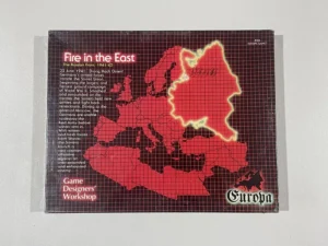 A board game called "Fire in the East" by Game Designers Workshop, depicting a map of Eastern Europe with an overlay of red areas and lightning bolt graphics, suggesting conflict areas during World War II. The graphic is part of the Europa wargame series.