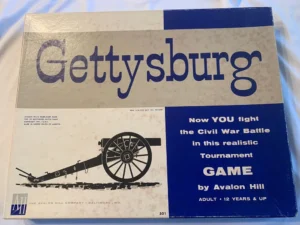 A photo of the board game "Gettysburg" by Avalon Hill, with text advertising it as a realistic Civil War battle tournament game for adults and children over 12 years of age.