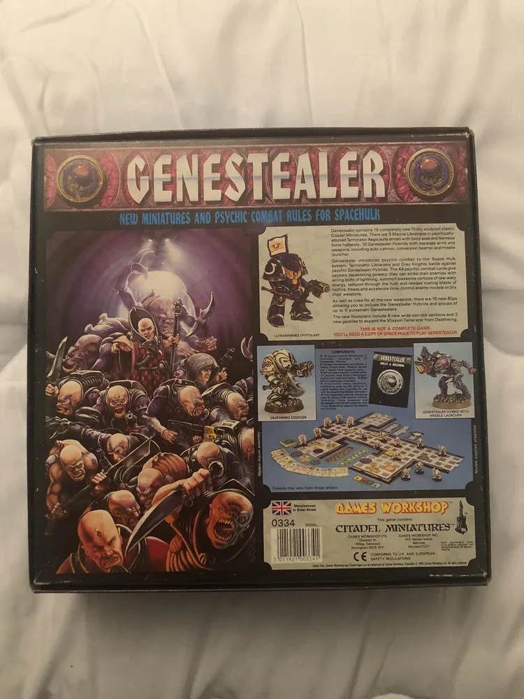 The image shows the back of the "Genestealer" board game box featuring new miniatures and psychic combat rules for the game "Space Hulk". The box art includes vivid illustrations of the game's characters engaged in combat and provides a glimpse of the miniature figurines, component layout, and some descriptive text about the game's contents. The Games Workshop and Citadel Miniatures logos, along with barcodes and item number 0334, are visible at the bottom.