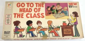 Vintage "Go to the Head of the Class" board game box cover by Milton Bradley, featuring illustrations of children engaged in classroom activities and playing the game, with a prominent "NEW 19th Edition" badge in the top right corner.