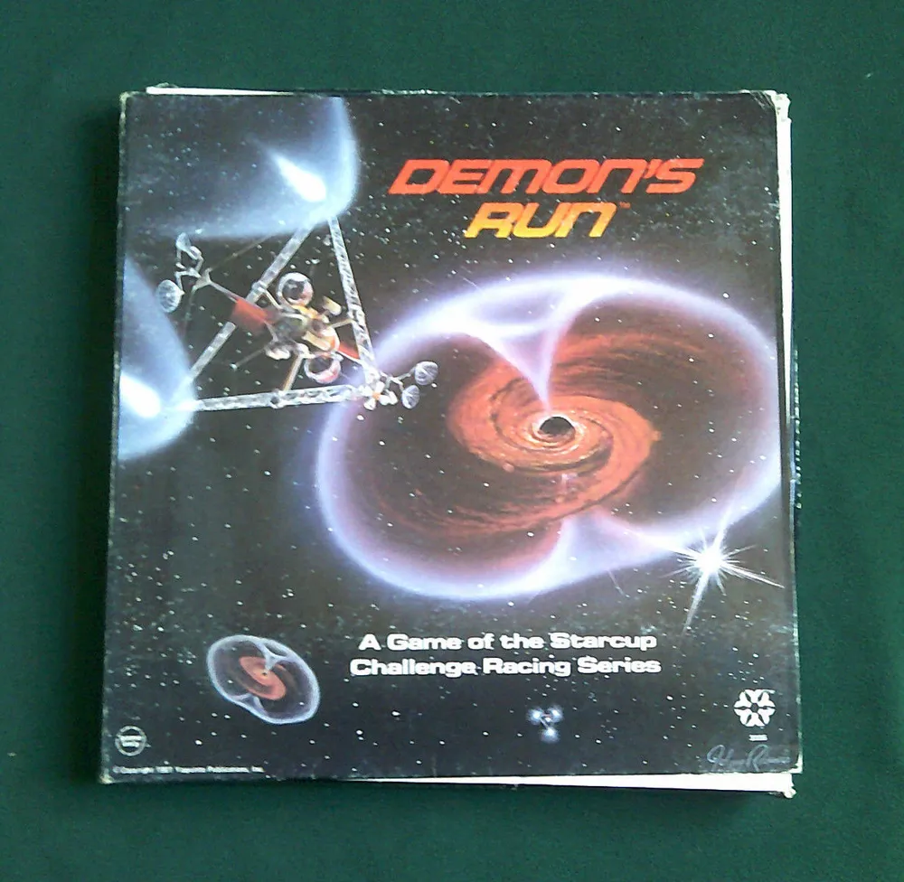 A worn board game box titled "DEMON'S RUN - A Game of the Starcup Challenge Racing Series" with an illustration of spaceships racing near a red swirling galaxy and bright stars on a dark space background.