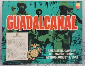 Vintage "Guadalcanal" board game cover featuring silhouettes of soldiers, a bold title in red, a letter excerpt, Marine Corps emblem, and the text "A realistic game of U.S. Marine Corps action - August 7, 1942".