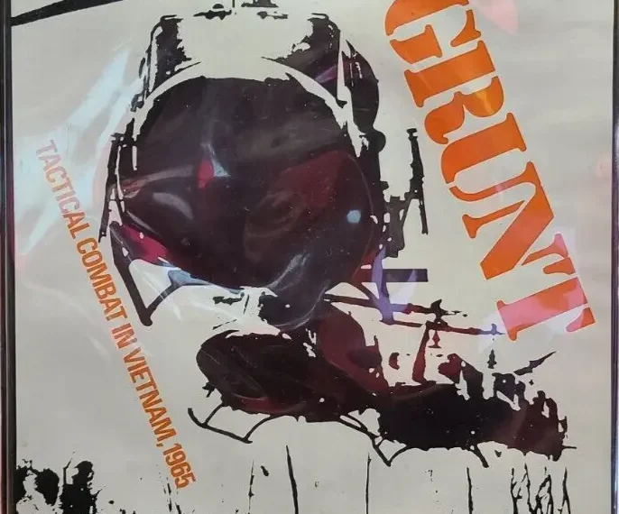 A board game cover featuring a helicopter in flight with a large title "GRUNT!" in orange letters. Below it reads "Tactical Combat in Vietnam 1965." It's described as "An Historical Simulation Game." The image has a high-contrast, stylized artistic design with a limited color palette.