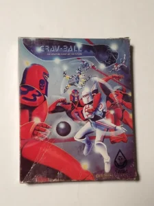 An image of a vintage "Grav-Ball" board game cover featuring stylized futuristic athletes in action around a black ball, with a cosmic backdrop and the subtitle "THE SPORTING EVENT OF THE FUTURE." The cover shows signs of wear and is partly covered by a plastic wrap.