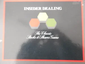 Board game cover titled "INSIDER DEALING" with the subtitle "The Classic Stocks & Shares Game," featuring hexagonal shapes in yellow and green.