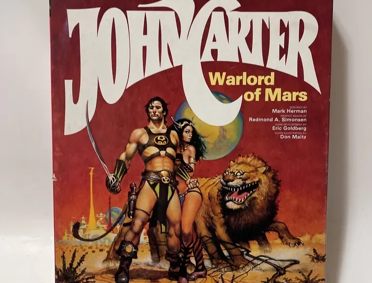 Vintage "John Carter Warlord of Mars" game box showing the title in large letters, artwork of a muscular man and a woman in warrior outfits, and a roaring alien creature, with the SPI company logo at the bottom.