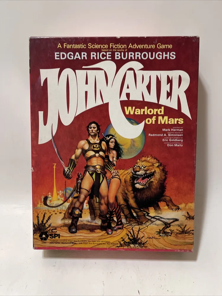 Vintage "John Carter Warlord of Mars" game box showing the title in large letters, artwork of a muscular man and a woman in warrior outfits, and a roaring alien creature, with the SPI company logo at the bottom.