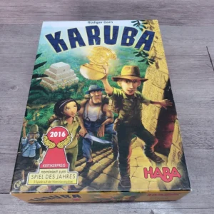 A board game box titled "KARUBA" by Rüdiger Dorn, with illustrations of adventurers in a jungle setting and an award label for '2016 Spiel des Jahres Nominee'. The game is produced by HABA.