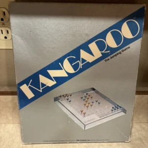 A game box for "KANGAROO The Jumping Game" with an image of the board game on the front, indicating it was made and printed in the USA. The box shows some wear and is placed on a tiled floor.