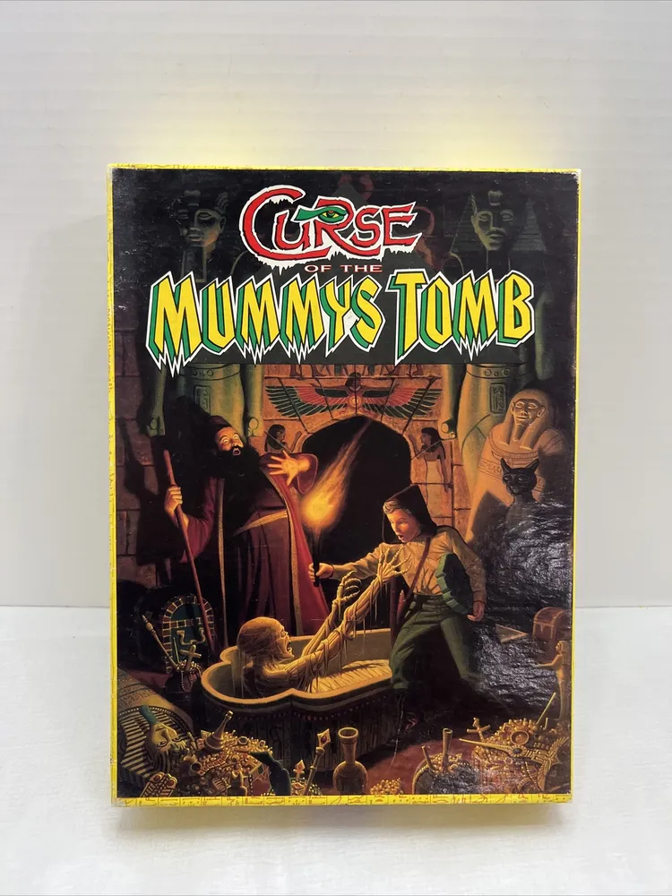 Board game titled "Curse of the Mummy's Tomb" depicting an illustrated scene with characters exploring an Egyptian tomb, with artifacts, a mummy, and eerie figures in the background.