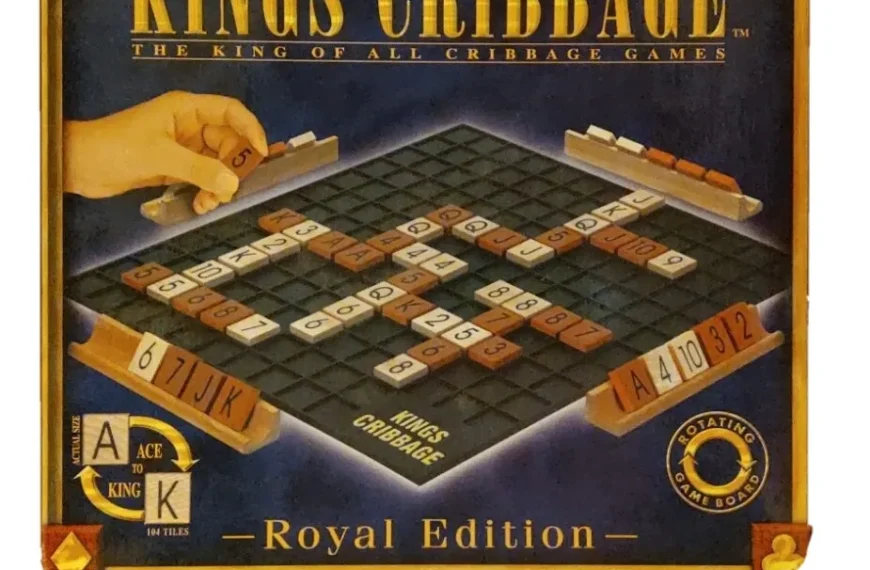 A board game box for "KINGS CRIBBAGE - THE KING OF ALL CRIBBAGE GAMES, Royal Edition" featuring a hand placing lettered tiles onto a game board that resembles a crossword puzzle, with racks holding additional tiles at the bottom and right side. The game includes a rotating board, with the title, edition, and other details displayed on the box's cover.