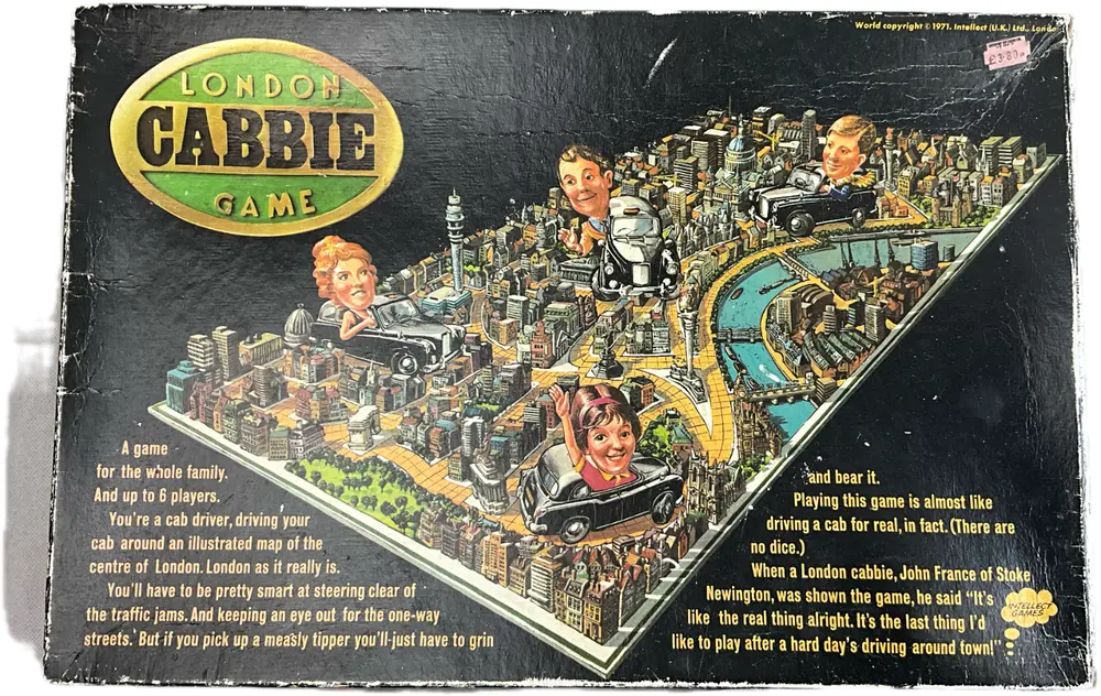 Picture of the board game "London Cabbie Game" box cover featuring an illustrated map of central London with cartoonish taxi driver heads popping out, a description of the game for up to 6 players, and a customer quote. Price sticker in the top right corner.