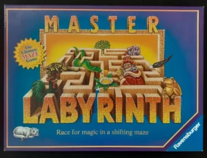 Box cover for "Master Labyrinth" board game by Ravensburger featuring a colorful illustrated maze with a wizard, creatures, and a tagline "Race for magic in a shifting maze."