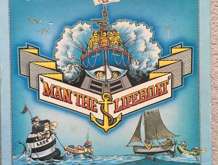 Board game box titled "MAN THE LIFEBOAT" featuring an illustrated nautical rescue scene with a lifeboat, sailors, and a sailboat on a stormy sea, labeled as an exciting sea rescue game for 2 to 4 players, ages 7 to adult.
