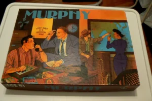 Vintage board game titled "MURPHY" depicting illustrated scenes of men in an office and a woman pointing to a map, styled in mid-20th-century artwork.