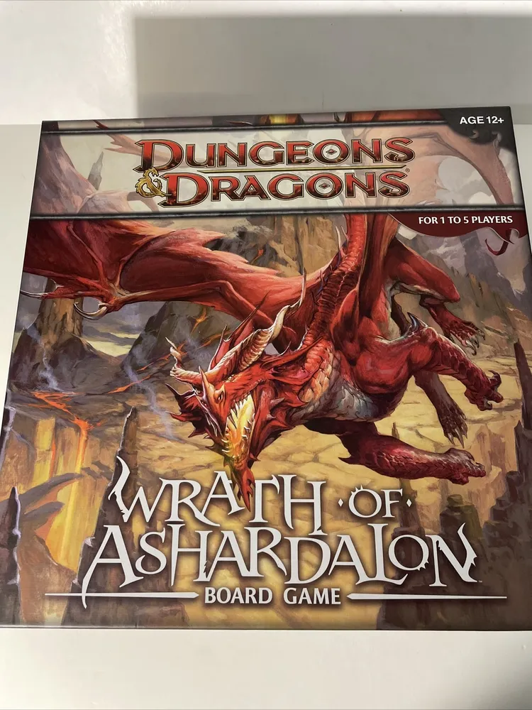 A "Dungeons & Dragons: Wrath of Ashardalon" board game box featuring an illustration of a red dragon, with text indicating it is suitable for ages 12+ and 1 to 5 players.