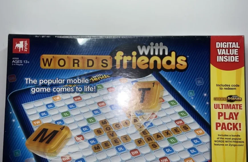 A boxed board game of "Words with Friends" with a tagline "The popular mobile game comes to life!" and a note on the side indicating a digital value "Ultimate Play Pack" included inside.