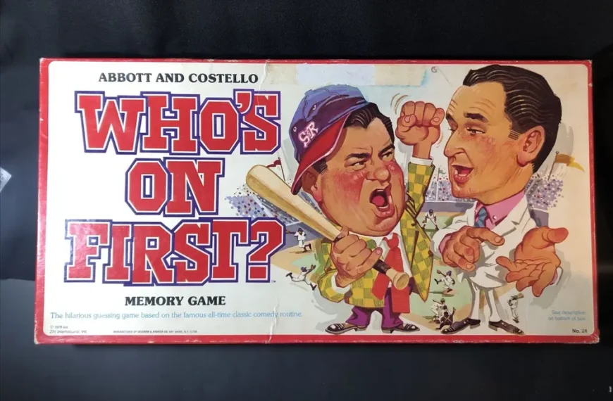 A vintage "Abbott and Costello Who's on First?" memory game box featuring illustrated caricatures of a shouting man in a baseball cap and a man in a suit pointing, with text and a cluttered baseball scene in the background.