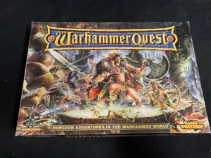 Box cover of "Warhammer Quest" board game featuring fantasy artwork with warriors and monsters, and logos for Citadel Miniatures and Games Workshop.