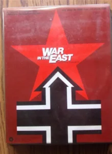 A worn board game box titled "WAR IN THE EAST", with a red star and a black cross symbol on a red background.