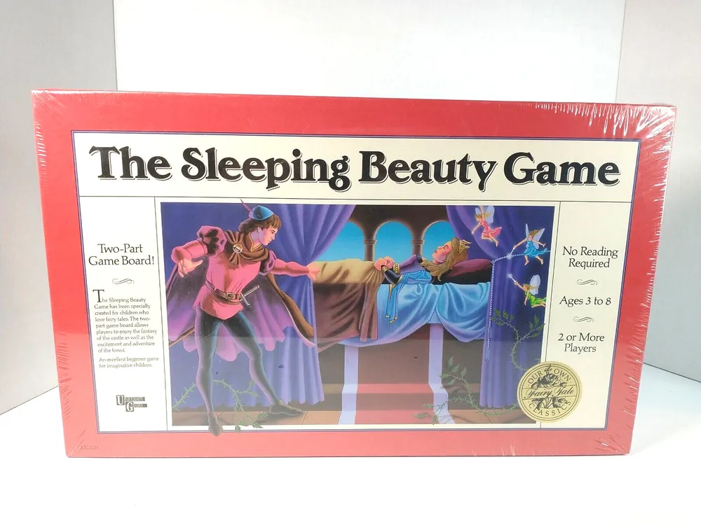A sealed board game box titled "The Sleeping Beauty Game" with illustrations of a prince and sleeping princess on the cover, indicating it's for ages 3 to 8, requires no reading, and is for 2 or more players.