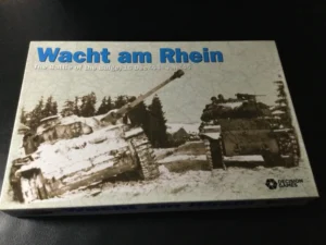 A boxed board game titled "Wacht am Rhein: The Battle of the Bulge, 16 Dec '44 - Jan '45", depicting World War II tanks in a snowy landscape, by Decision Games.