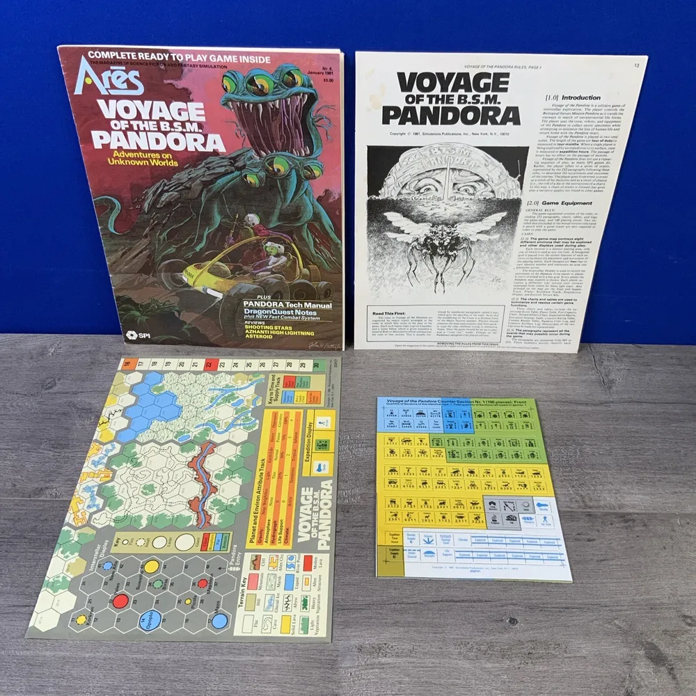 A display of game materials for "Voyage of the B.S.M. Pandora," including game box cover art, manuals, a board with hexagonal mapping, and several charts on a table with a blue background.