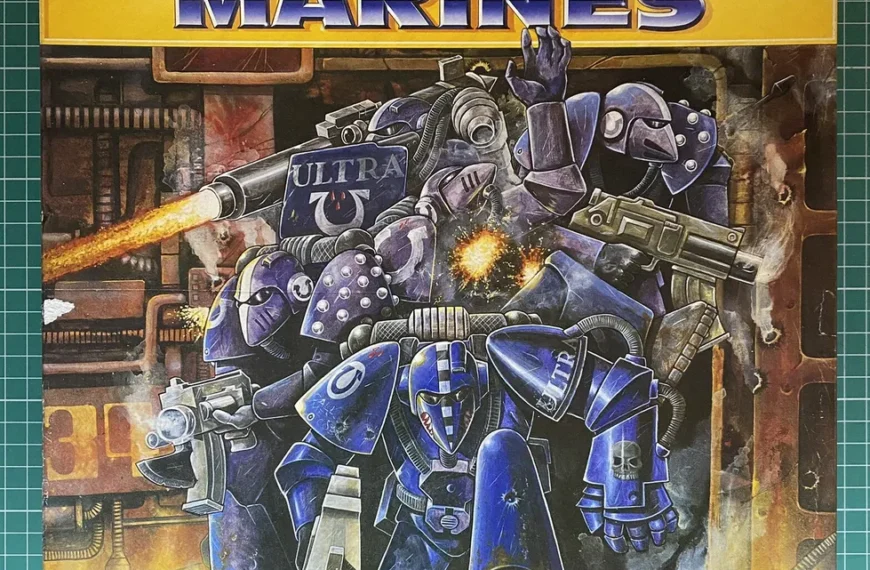 Alt text: The image shows the cover art for a game titled "ULTRAMARINES," featuring illustrated futuristic armored warriors in blue and purple with the tagline "The Game of Ultimate Warriors from the Far Future." One of the warriors is firing a weapon with a visible blast. The background hints at an industrial setting.