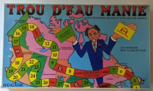 Board game titled "TROU D'EAU MANIE" with a caricature of a man in a suit holding cards labeled with "CARTE CONSTITUTION", a colorful map of Canada with numbered spaces forming a path, text in French stating it's a game of chance for 2 to 6 players aged 12 and up, and additional game instructions.