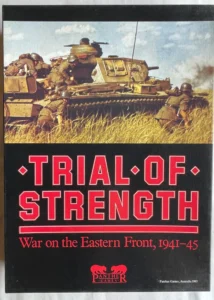 Cover of the "Trial of Strength: War on the Eastern Front, 1941-45" board game featuring an image of a tank with soldiers on a field, with the game's title in bold red letters and the Panther Games logo below.