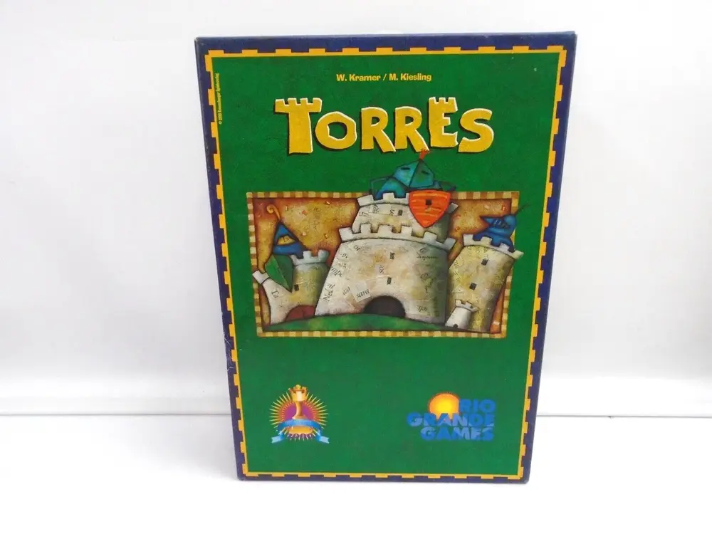A board game titled "Torres" with illustrations of a castle and knights displayed on the cover, designed by W. Kramer and M. Kiesling, and published by Rio Grande Games.