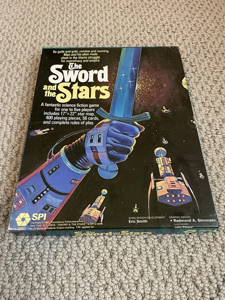 Alt text: The cover of a vintage board game titled "The Sword and the Stars," showing a stylized illustration of a futuristic space scene with a large blue and purple glove holding a sword that transforms into a spaceship, set against a backdrop of stars, planets, and smaller spacecraft. The cover displays game details and credits, including the game being a science fiction game for one to five players and the names Eric Smith and Redmond A. Simonsen for game and graphic design, respectively. The box is laying on a carpeted floor.