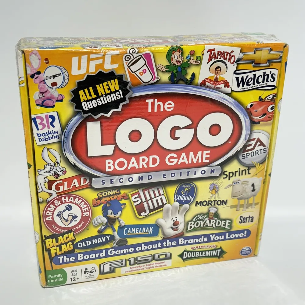 Boxed "The Logo Board Game Second Edition" with various brand logos and characters on the cover, indicating a family game for ages 12 and up.