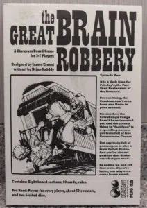 Alt text: Cover of a black and white board game titled "The Great Brain Robbery", designed by James Ernest with art by Brian Snoddy, depicting a cartoonish illustration of a zombie robbing passengers on a train. The game is labeled as a Cheapass Board Game for 3-7 players, with additional text describing the theme and contents of the game.