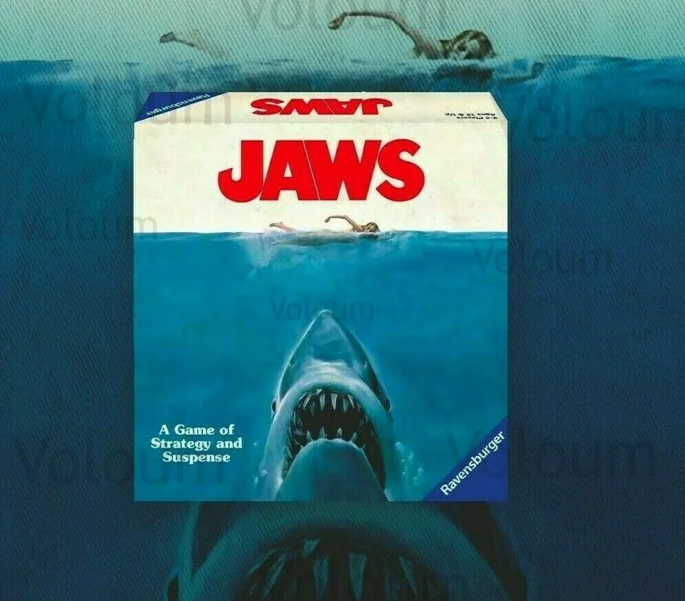 A board game cover of "JAWS", depicting a great white shark coming up from the water with a swimmer on the surface, with the text "A Game of Strategy and Suspense" at the bottom left and the Ravensburger logo at the bottom right.