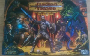 Box cover of "Dungeons & Dragons: The Fantasy Adventure Board Game" featuring fantasy characters such as warriors and monsters engaging in battle, with text highlighting easy setup and 40 detailed miniatures included.