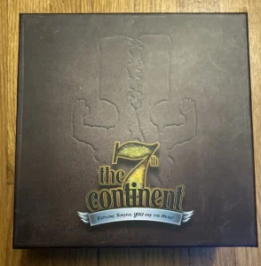 A board game box titled "The 7th Continent" with the tagline "Explore. Survive. You are the hero!" featuring embossed silhouette figures and a footprint on a dark background.