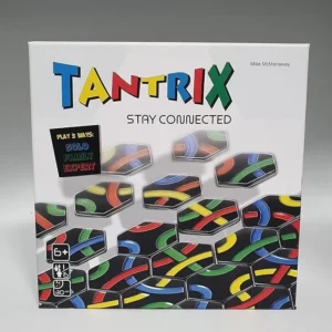 A box of the Tantrix puzzle game titled "STAY CONNECTED" with the tagline "Play 3 Ways: SOLO, FAMILY, EXPERT" and additional details indicating suitable for ages 6 and up, 1 to 6 players, and a game duration of 30 minutes. The game's pieces, featuring colorful intertwined paths, are displayed on the cover.