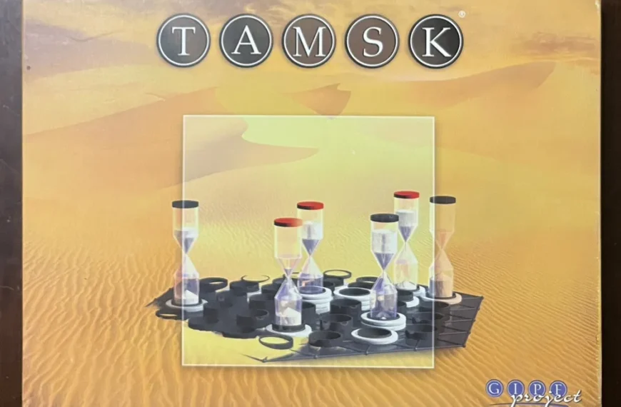 Box cover of the board game Tamsk, showing sand timer game pieces on hexagonal board tiles with the game's name in white letters at the top.
