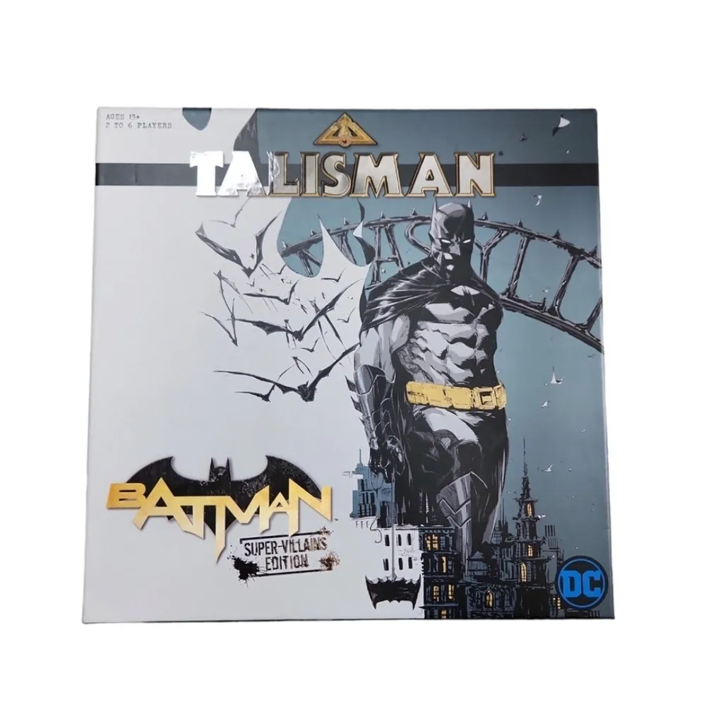 A board game called "Talisman: Batman Super-Villains Edition" featuring an illustration of Batman standing on a gargoyle with a backdrop of Gotham City, with the DC logo in the corner.