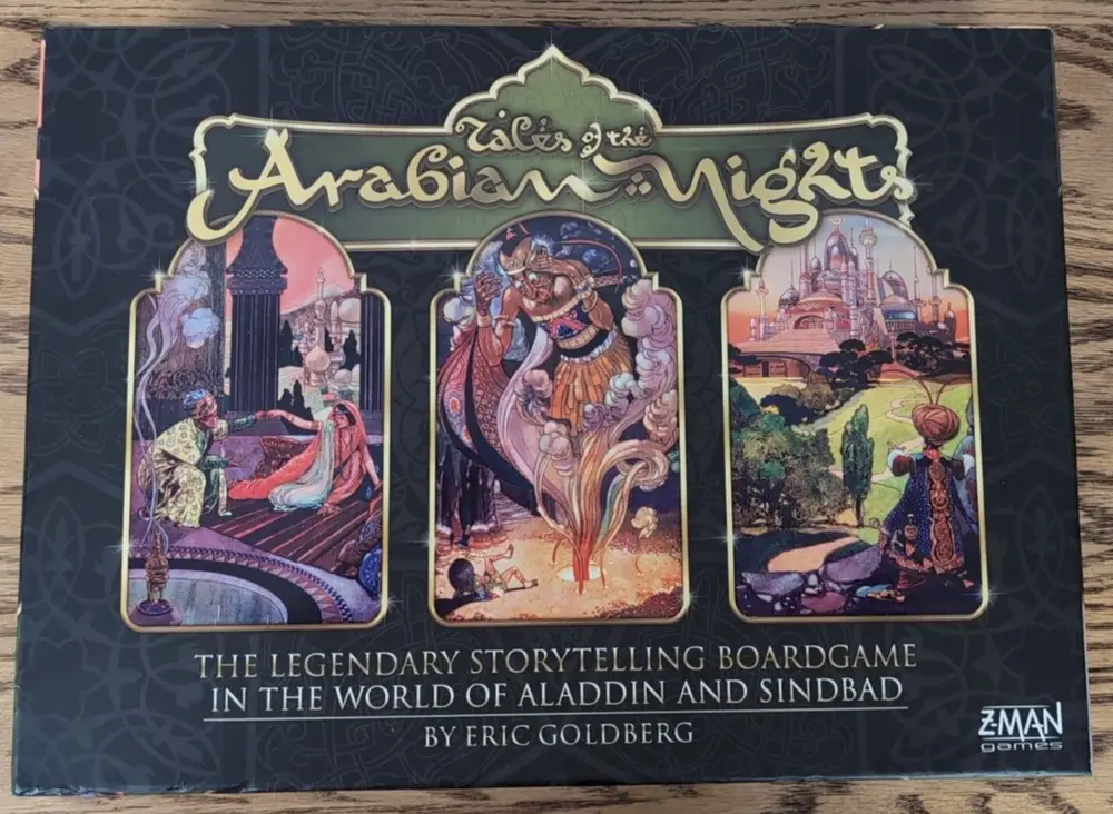 Box cover of "Tales of the Arabian Nights," a storytelling board game themed around the world of Aladdin and Sinbad, featuring colorful illustrated panels depicting scenes from Arabian Nights, with text by Eric Goldberg and the Z-Man Games logo.