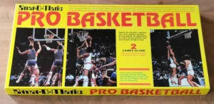 Box of "Strat-O-Matic Pro Basketball" board game featuring images of basketball players in action, game title in bold yellow letters, and descriptive text about gameplay.