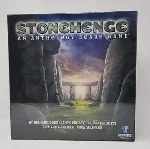Box cover of "Stonehenge: An Anthology Board Game" featuring a graphic of Stonehenge in the background and the names of designers Richard Borg, James Ernest, Bruno Faidutti, Richard Garfield, and Mike Selinker on the bottom.