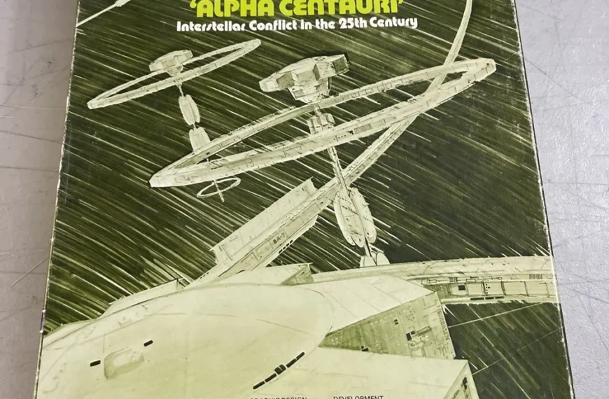 A worn box cover of "STARFORCE ALPHA CENTAURI: A Future-History Simulation Game", featuring stylized spaceship illustrations and labeled as "Designer's Edition".