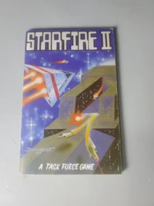"Starfire II" game booklet with space-themed artwork featuring spacecraft and a tagline reading "A TASK FORCE GAME", displayed on a white surface.